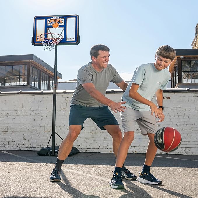 Lifetime NBA New York Knicks Portable Basketball Hoop, Adjustable Height 7.5-10 Ft, 44 Inch Shatterproof Fusion Backboard, Base with Wheels