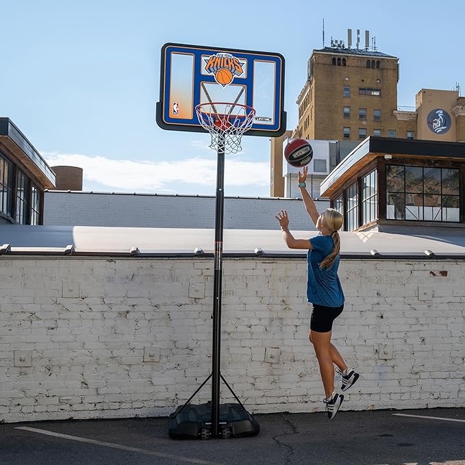 Lifetime NBA New York Knicks Portable Basketball Hoop, Adjustable Height 7.5-10 Ft, 44 Inch Shatterproof Fusion Backboard, Base with Wheels